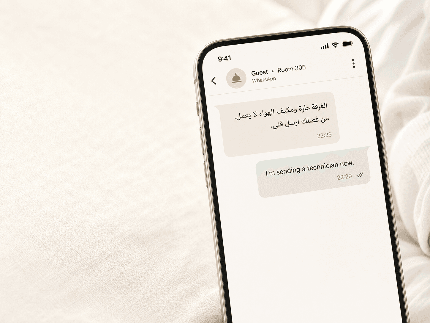 A hotel guest message in Arabic and Renavo's confirmed technician response on a phone